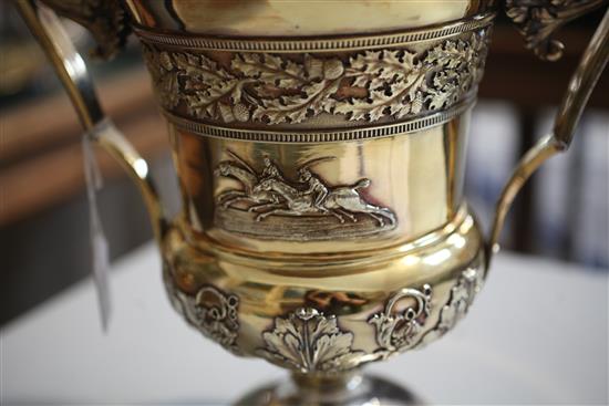 A handsome George III silver gilt two handled presentation pedestal trophy cup and cover by William Elliot, 93.5 oz.